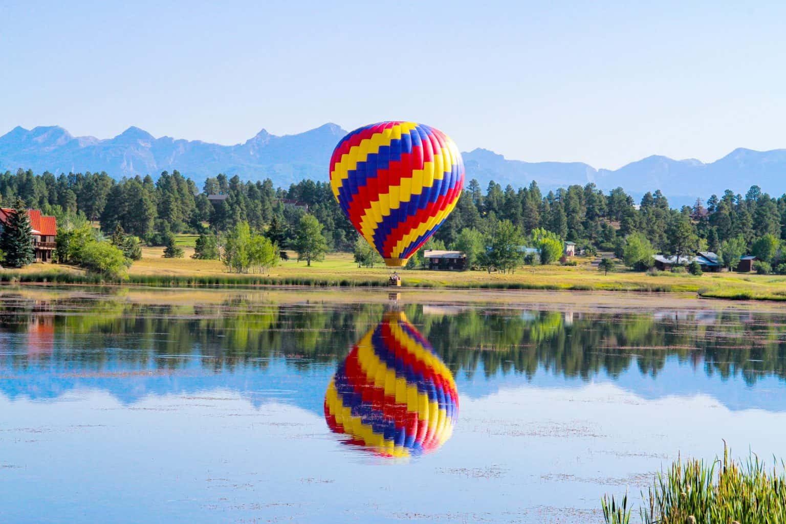 Hot Air Balloon Reflection Over Water